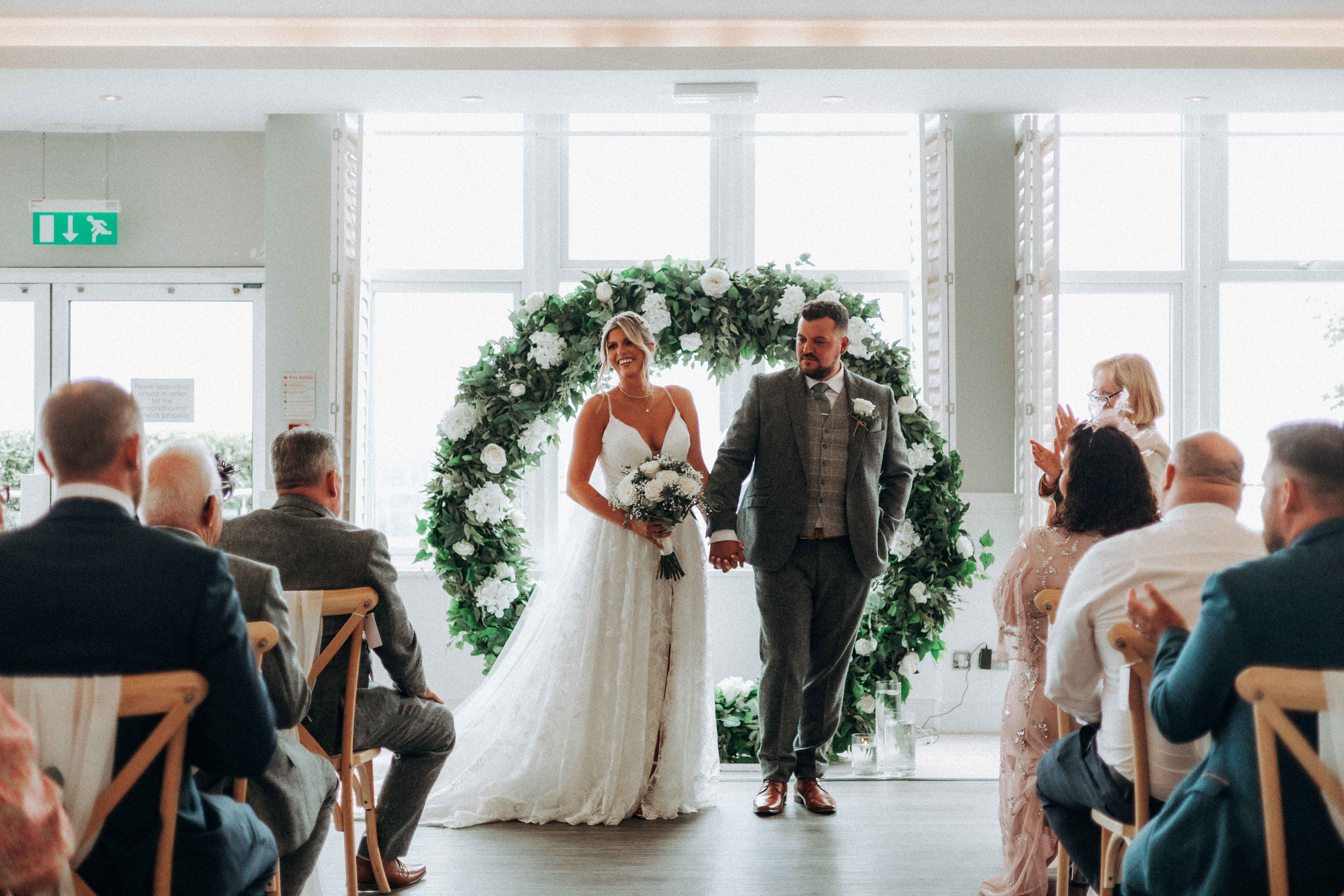 An indoor wedding ceremony with a sea view at Harbour Hotel St Ives